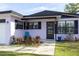 Up close view of a home's exterior highlighting brick, window details, and front yard decor at 509 Mcintosh Rd, Ormond Beach, FL 32174