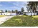 Charming single-story home with a well-maintained lawn, driveway, and colorful exterior paint at 509 Mcintosh Rd, Ormond Beach, FL 32174