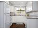 Bright, modern kitchen showcasing white cabinetry, granite countertops, and stainless steel appliances at 509 Mcintosh Rd, Ormond Beach, FL 32174