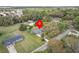 Aerial view of property showcasing lush landscaping, surrounding trees, and privacy at 512 Power Rd, Sanford, FL 32771
