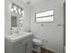 Bright bathroom featuring modern lighting and a gray vanity at 512 Power Rd, Sanford, FL 32771