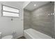 Bathroom with updated shower and tub combination at 512 Power Rd, Sanford, FL 32771