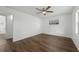 Spacious bedroom featuring hardwood floors, ceiling fan and a side window at 512 Power Rd, Sanford, FL 32771