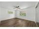Bedroom with hardwood floors, ceiling fan, and ample natural light at 512 Power Rd, Sanford, FL 32771