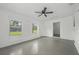 Versatile bonus room featuring neutral walls, natural light, and a ceiling fan at 512 Power Rd, Sanford, FL 32771