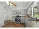 Updated kitchen with stainless steel appliances and grey cabinetry at 512 Power Rd, Sanford, FL 32771