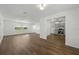 Open living room boasts hardwood floors and seamless flow to the adjacent kitchen at 512 Power Rd, Sanford, FL 32771