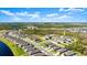 High-angle aerial of the property, highlighting a well-planned community near natural areas with manicured lawns and coordinated home design at 615 Tortuga Ct, New Smyrna Beach, FL 32168