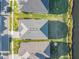 Aerial shot showcasing the home's roof, landscaping, and proximity to the lake at 6263 W Fallsgrove Ln, Port Orange, FL 32128