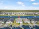 Community aerial view highlighting home's location on the lake, surrounded by lush greenery at 6263 W Fallsgrove Ln, Port Orange, FL 32128