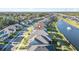Wide aerial view showcases the property's lakeside location within a sprawling residential community at 6263 W Fallsgrove Ln, Port Orange, FL 32128