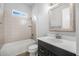 Bathroom featuring a shower-tub combination, granite counters, and modern fixtures, offering a relaxing experience at 6263 W Fallsgrove Ln, Port Orange, FL 32128