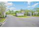 Inviting entrance to Spruce Meadow Woodhaven, showcasing the community's well-maintained landscaping at 6263 W Fallsgrove Ln, Port Orange, FL 32128