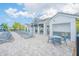 Community pool with ample seating and shaded areas, offering a resort-style experience at 6263 W Fallsgrove Ln, Port Orange, FL 32128