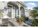 Inviting front entrance with decorative glass door, stone accents, and a paved walkway at 6263 W Fallsgrove Ln, Port Orange, FL 32128