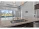 Island sink with stainless appliances overlooks the community's lakefront view at 6263 W Fallsgrove Ln, Port Orange, FL 32128