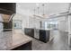 Modern kitchen with island bar, stainless steel appliances, and an open floor plan at 6263 W Fallsgrove Ln, Port Orange, FL 32128