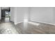 Open living area with wood-look tile floors and bright natural light at 6263 W Fallsgrove Ln, Port Orange, FL 32128