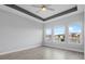 Main bedroom overlooking the lake featuring three large windows with natural light at 6263 W Fallsgrove Ln, Port Orange, FL 32128