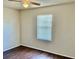 Bedroom features a window with laminate wood floors at 662 Comstock Dr, Deltona, FL 32738
