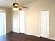 Bedroom with wood floor, ceiling fan, and closet at 662 Comstock Dr, Deltona, FL 32738