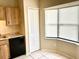 Kitchen nook featuring ample cabinet space, granite countertops, and a corner window at 662 Comstock Dr, Deltona, FL 32738