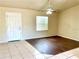 Inviting living room with hardwood flooring, ceiling fan, and lots of natural light at 662 Comstock Dr, Deltona, FL 32738