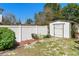 Spacious backyard with a storage shed and a well-maintained white fence at 707 Leeward Dr, Deltona, FL 32738