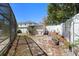 A partially shaded backyard featuring a shed and the screened in pool area at 707 Leeward Dr, Deltona, FL 32738