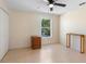 Bedroom featuring a window, ceiling fan, closet, and a set of drawers at 707 Leeward Dr, Deltona, FL 32738
