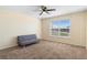 Bedroom featuring a window, ceiling fan, and a gray futon at 707 Leeward Dr, Deltona, FL 32738