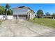 A spacious driveway leads to a two-story home with a two car garage at 707 Leeward Dr, Deltona, FL 32738