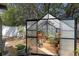 An open greenhouse filled with potted plants and flowers, creating a gardener's paradise at 707 Leeward Dr, Deltona, FL 32738