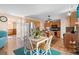 Charming kitchen with stainless steel appliances, wooden cabinetry, and an adjacent dining area at 707 Leeward Dr, Deltona, FL 32738