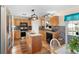 Modern kitchen featuring granite countertops, stainless steel appliances, and wooden cabinets at 707 Leeward Dr, Deltona, FL 32738