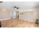 Open floor plan featuring laminate floors, neutral walls, and recessed lighting creating a seamless flow at 707 Leeward Dr, Deltona, FL 32738