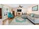 Spacious living room featuring plush seating, a large window, and stylish decor at 707 Leeward Dr, Deltona, FL 32738
