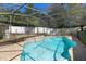 Private in-ground pool with a screened enclosure and patio area at 707 Leeward Dr, Deltona, FL 32738