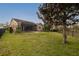 Fenced backyard with lush lawn and screened lanai, providing space for recreation and relaxation at 903 Victoria Hills S Dr, Deland, FL 32724