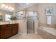 Luxurious bathroom with a soaking tub, glass shower, and vanity area at 903 Victoria Hills S Dr, Deland, FL 32724