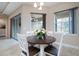 Cozy breakfast nook with wood table, seating for four, and natural light at 903 Victoria Hills S Dr, Deland, FL 32724