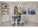 Cozy dining room featuring neutral decor, elegant light fixture, and niche shelving at 903 Victoria Hills S Dr, Deland, FL 32724