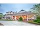 Beautiful clubhouse exterior with covered patio and manicured landscaping at 903 Victoria Hills S Dr, Deland, FL 32724