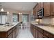 Bright kitchen featuring stainless steel appliances, granite counters, and breakfast nook at 903 Victoria Hills S Dr, Deland, FL 32724