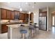 Modern kitchen with granite countertops, stainless steel appliances, and a breakfast bar perfect for casual dining at 903 Victoria Hills S Dr, Deland, FL 32724