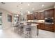 Gourmet kitchen featuring granite countertops, stainless steel appliances, and a breakfast bar with seating at 903 Victoria Hills S Dr, Deland, FL 32724