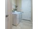 Laundry room featuring washer, dryer and shelving at 903 Victoria Hills S Dr, Deland, FL 32724