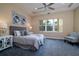 Comfortable main bedroom featuring a tray ceiling, plush carpet, and ample natural light at 903 Victoria Hills S Dr, Deland, FL 32724