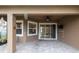 Covered patio featuring ceiling fan and stone flooring and view to outdoors at 903 Victoria Hills S Dr, Deland, FL 32724
