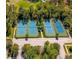 Aerial view of community tennis courts surrounded by mature trees at 903 Victoria Hills S Dr, Deland, FL 32724